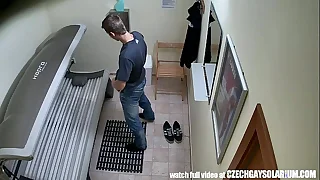 Young suppliant secretly filmed in public solarium